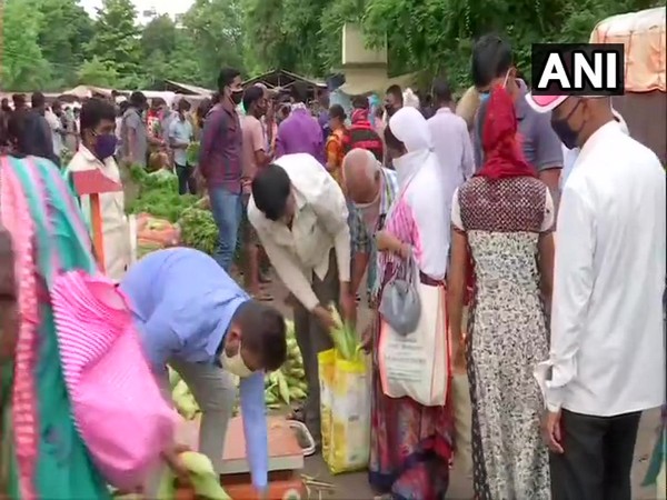 People at a vegetable market in Pune today ahead of 10-day lockdown. (Photo/ANI)