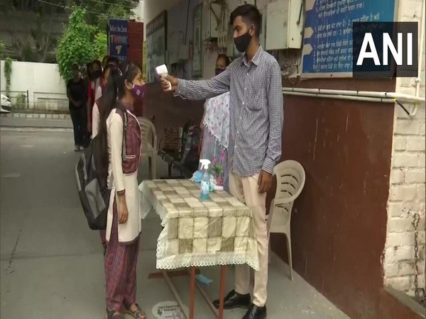 Students getting thermally scanned at a government school in Amritsar before entering into classrooms