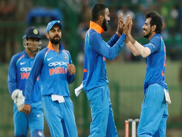 India's Hardik Pandya celebrates with captain Virat Kohli, Rohit Sharma, MS Dhoni and Lokesh Rahul after taking a wicket
