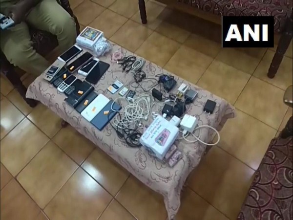 The mobile phones, chargers and other items seized from the prisoners in Kerala. (Photo: ANI)