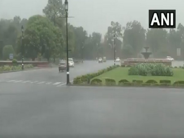 Rain lashes parts of national capital; visuals from Rajpath. (Photo/ANI)