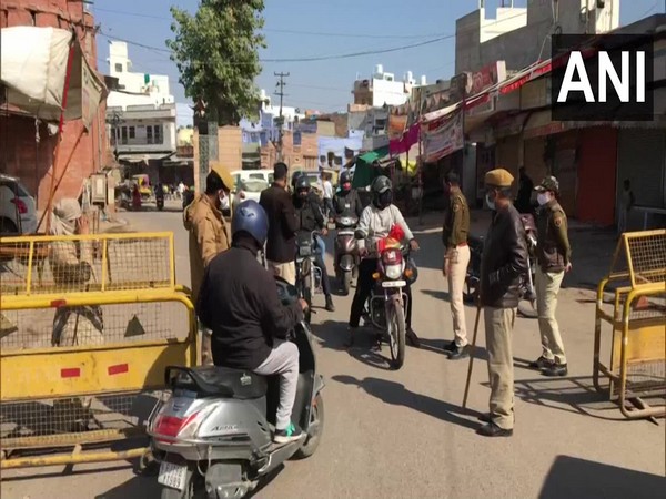 Police stops people at check points during Sunday curfew. (ANI/photo)