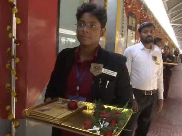 Railway staff at Howrah welcomed Rajdhani passengers with flowers on golden jubilee run of the train on Sunday