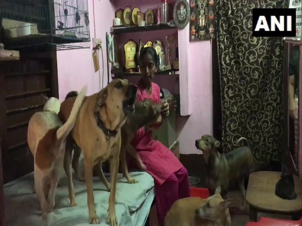 Rajni Shetty with her dogs at her house in Mangaluru. (ANI/pictures)