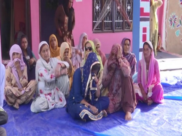 The family membrers of deceased Ranjit Singh in Rajouri. (ANI/photo)