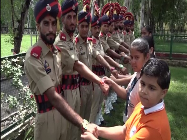 The school girls tied rakhi on the wrists of the security personnel here on Wednesday in Kathua
