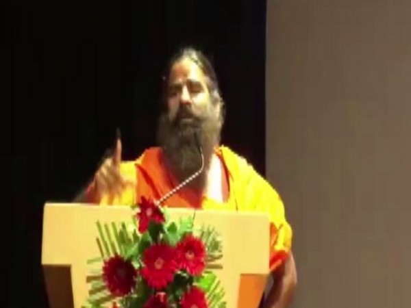 Yoga Guru Ramdev speaking at an event in Noida, Uttar Pradesh on Tuesday. (Photo/ANI)