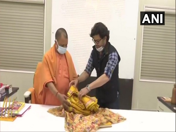 Clothes made of 'khadi' for Ram lalla presented to UP CM by designer Manish Tripathi (Photo/ ANI)