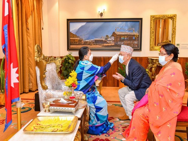 Nepal President Bidhya Devi Bhandari on Monday offered Tika to Prime Minister KP Sharma Oli along with the first lady on Bijaya Dashami. Photo/ANI