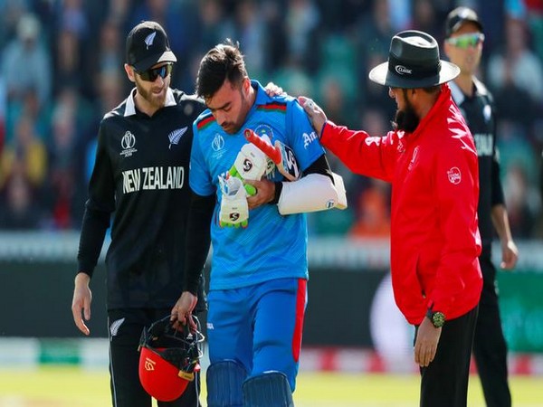 Rashid Khan leaving the ground 