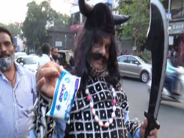 Man dressed up as Ravana distributed milk in Pune on Friday. (ANI/pictures)