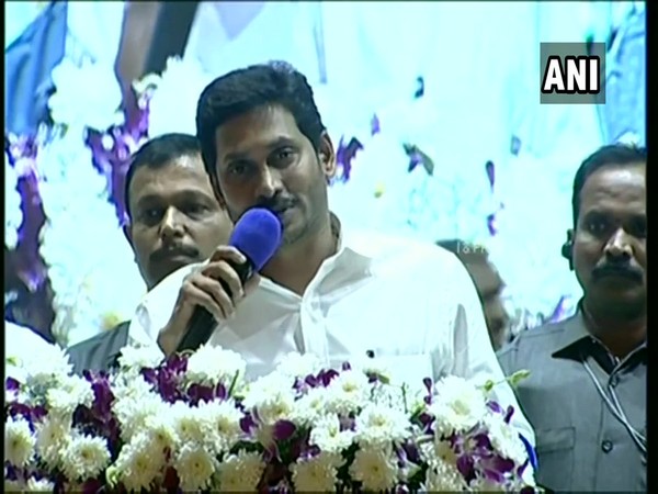 Andhra Pradesh CM Jagan Reddy addressing a gathering at the launch of YSR Post Operative Sustenance scheme in Guntur on Monday. (Photo/ANI)