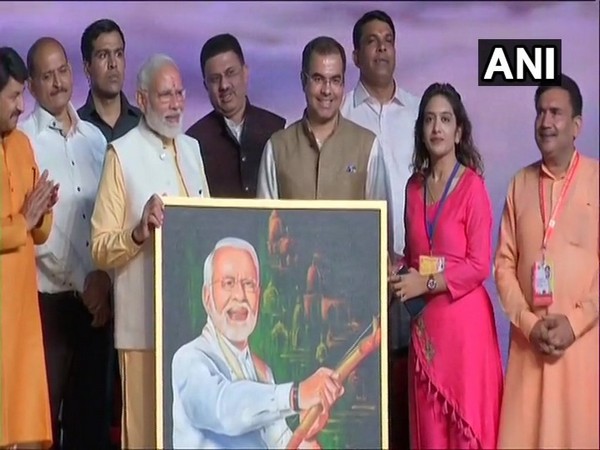 Renuka presented painting to PM Modi at Rameela ground Dwarka, New Delhi on Tuesday