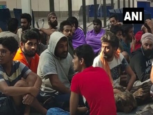 Repatriated Indians gathered outside IGI airport in New Delhi on Friday