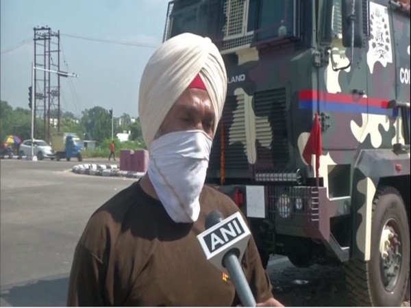 Officer Karnail Singh with the Command Vehicle (Photo/ANI)