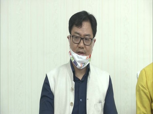Union Minister Kiren Rijiju speaking to reporters on Sunday. 