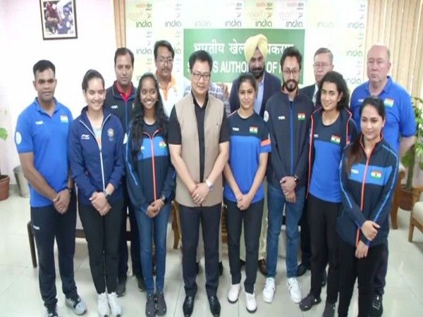 Union Youth Affairs and Sports Minister Kiren Rijiju with the medal winner shooters of the ISSF World Cup