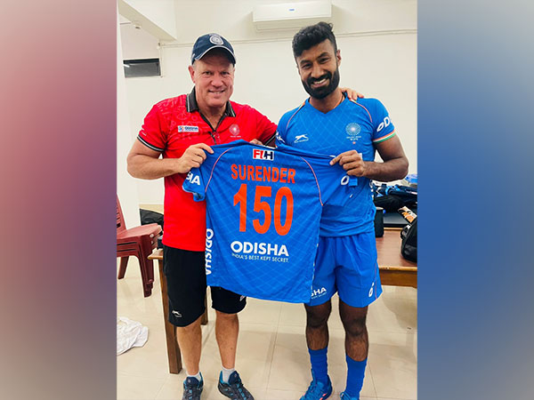 Surender Kumar with coach Graham Reid before his 150th international match (Image: HI)