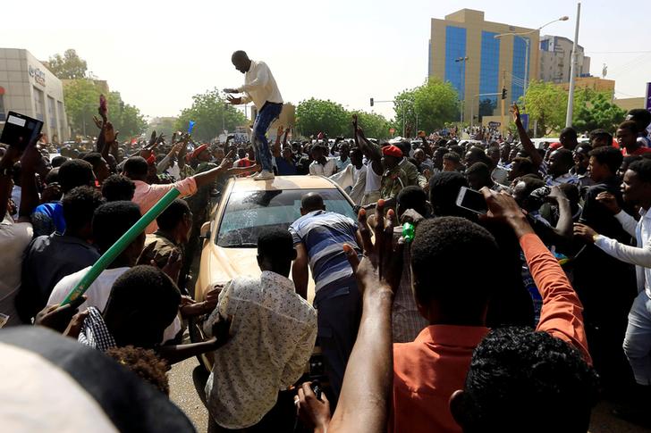 Protesters demonstrate outside President Omar al-Bashir’s Office in Khartoum on Thursday.