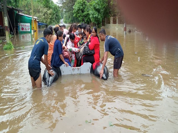 Visuals of Indian Navy personnel rescuing people. 