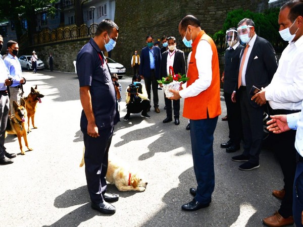 A canine from Himachal Pradesh police's dog squad saluted Chief Minister Jai Ram Thakur and Assembly Speaker Vipin Singh Parmar today. (Photo/ANI) 