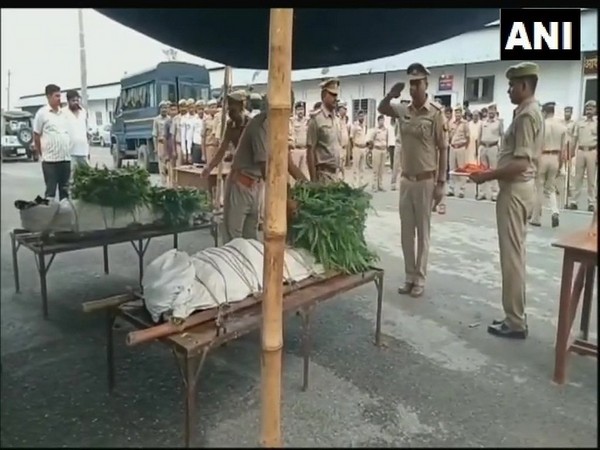 Uttar Pradesh police while paying tribute to two police personnel killed in Sambhal on Thursday. Photo/ANI