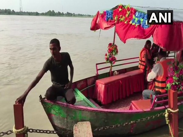 Visitors at Sarayu river wearing life jackets on Wednesday. Photo/ANI