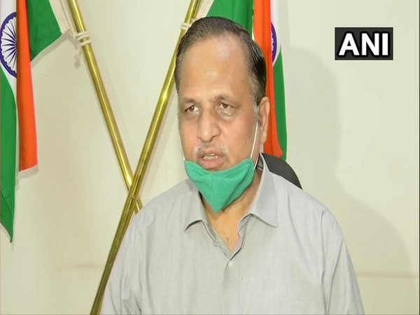 Delhi Health Minister Satyendar Jain speaking to reporters on Saturday.