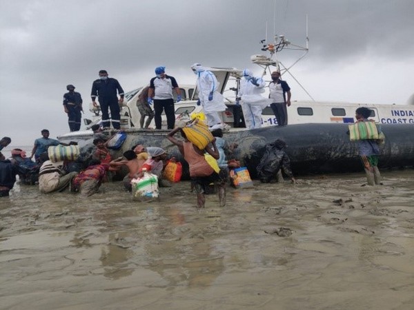Indian Coast Guard helping locals in Odisha. (Photo/PIB).