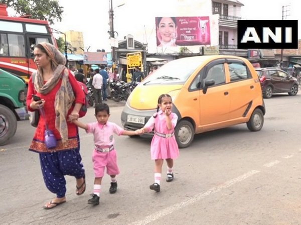 Students on their way to Govt. Girls Higher Secondary School in Udhampur on Friday. Photo/ANI