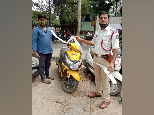 Arun Kumar with his scooter in Bengaluru on Friday. (Photo/ANI)