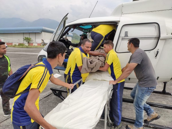 The SDRF team airlifts a man from Kedarnath after he fell ill on Friday. (Photo/ANI)