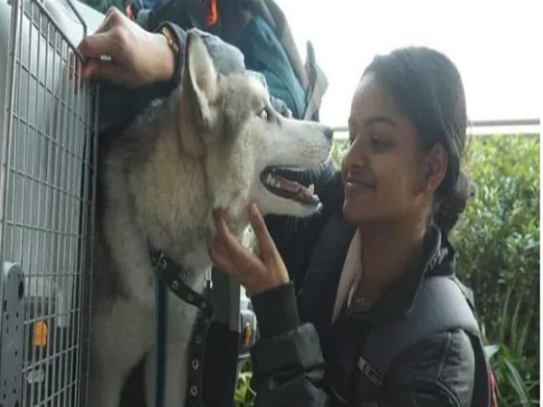 Kerala medical student Arya Aldrin with her dog (Photo/ANI)