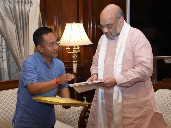 Sikkim Chief Minister Prem Singh Tamang (Left) 