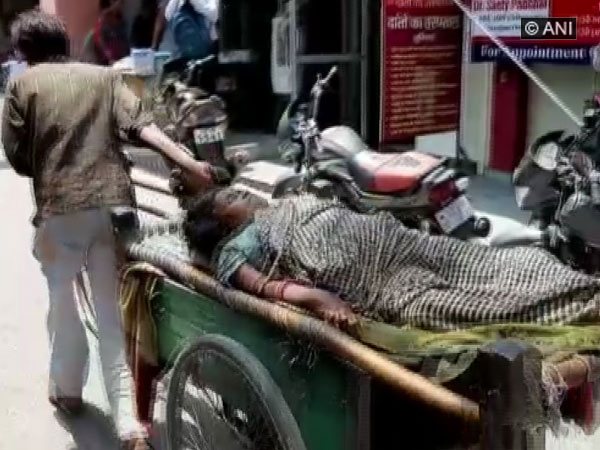 Man driving the woman in cart to hospital in Shamli, Uttar Pradesh.