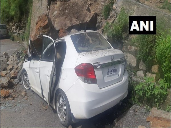 Boulders hit an unoccupied car in Shimla on Thursday. Photo/ANI