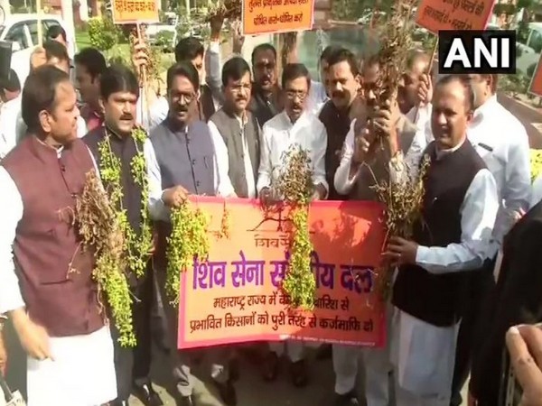 Shiv Sena leaders held a protest on Parliament premises, demanding relief measures for farmers. Photo/ANI