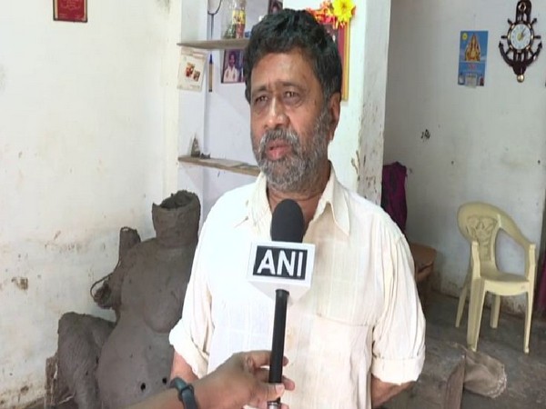 Ganesh, an idol maker of the Kumabara community speaks to ANI after floods in the state washed away his only livelihood on Friday. Photo/ANI