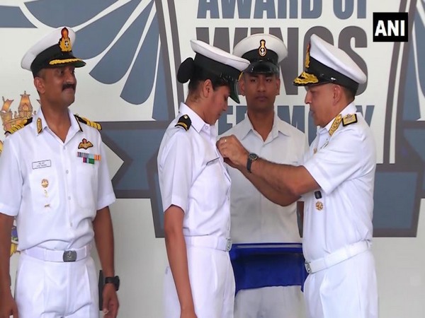 Shivangi receives her qualification 'wings' from Vice Admiral AK Chawla at Naval Base Kochi. Photo/ANI