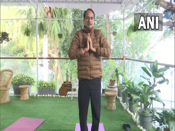 Madhya Pradesh CM Shivraj Singh Chouhan performs Surya Namaskar on National Youth Day today (Photo/ANI)