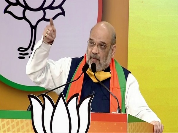 Union Home Minister and BJP leader Amit Shah speaking at the West Bengal Jan Samvad Rally on Tuesday. (Photo/ANI)