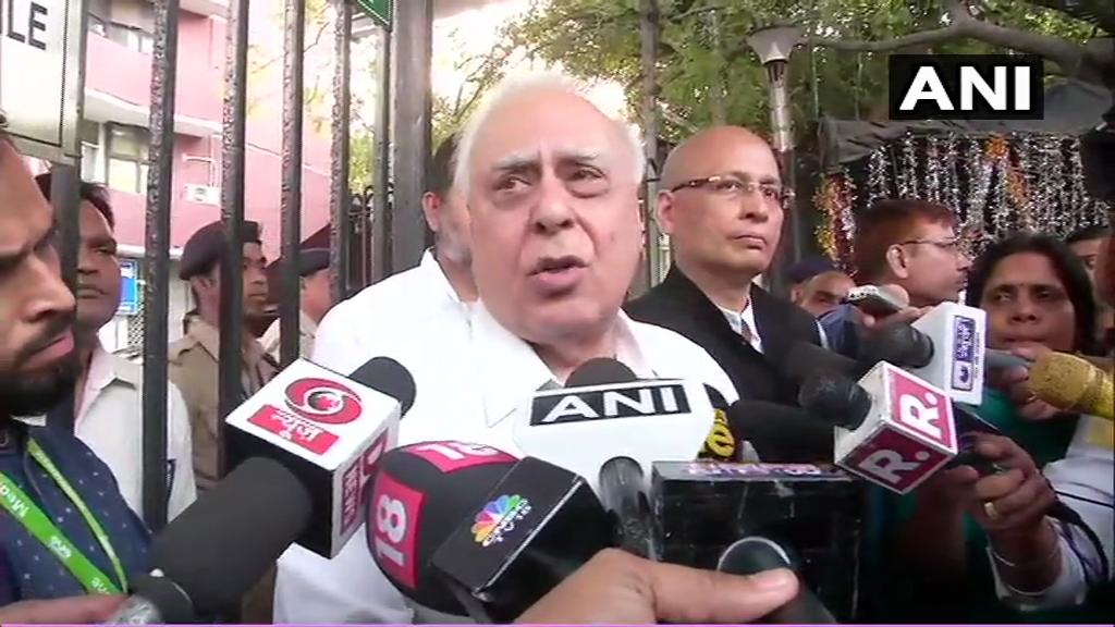 Congress leader Kapil Sibal talking to media persons in New Delhi after giving representation to EC on Monday 