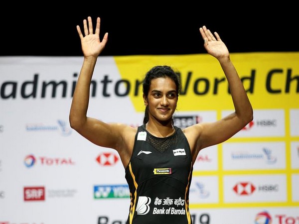 PV Sindhu posing after winning gold at the BWF World Championships.