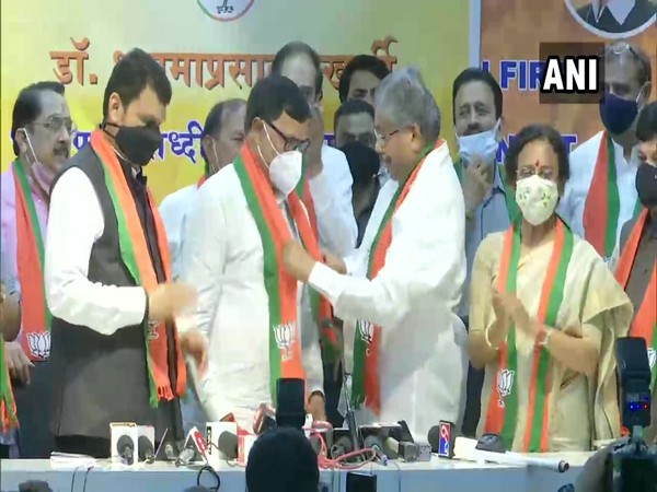 Former Congress Minister Kripashankar Singh joins BJP in presence former Chief Minister Devendra Fadnavis and party state president Chandrakant Patil. (Photo/ ANI)