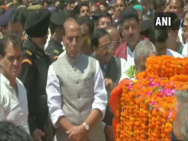 Union Defence Minister Rajnath Singh while paying tribute to Prakash Pant in Pithoragarh on Saturday. (Photo: ANI) 