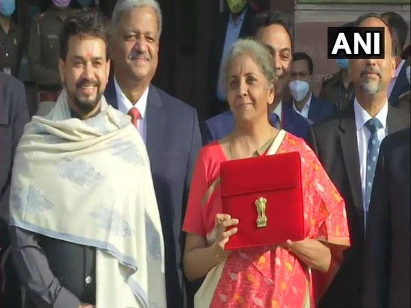The Finance Minister was seen carrying a tablet kept inside a red coloured cover with a golden national emblem embossed on it. [Photo/ANI]