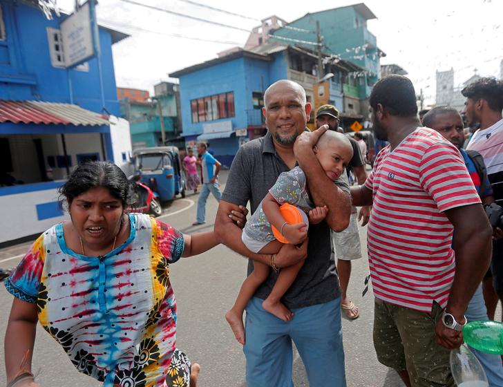 Visuals of a family fleeing their house as the military tries to defuse a suspected van before it exploded, in Colombo, Sri Lanka on April 22. Photo/Reuters