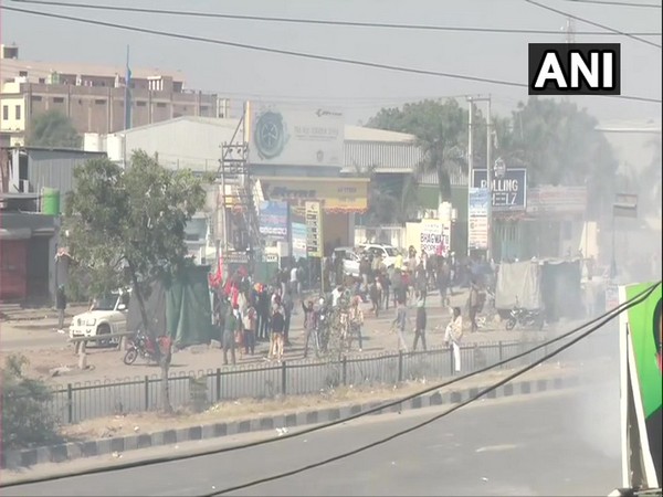 Plumes of smoke were seen at Singhu border (Haryana-Delhi border) as the security personnel used tear gas to disperse farmers protesting on Friday. [Photo/ANI]