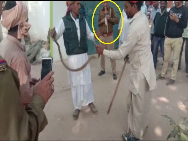 A cop at Himpurdeepa police station caught on camers while playing Pungi on Wednesday. [Photo/ANI]