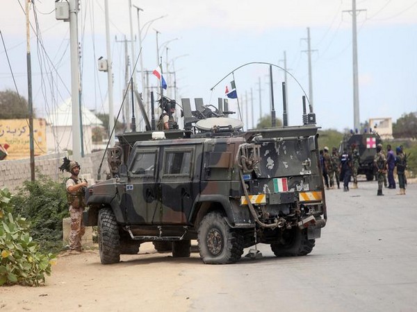 Italian security forces were seen near armoured vehicles at the scene of an attack on an Italian military convoy in Mogadishu, Somalia on Monday
